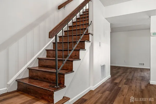 a view of entryway with wooden floor