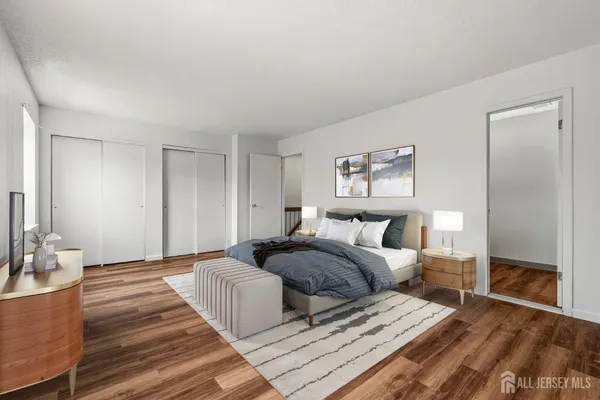 a spacious bedroom with a bed and a mirror