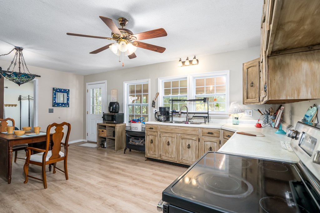 1813 John Smith Road East Blairsville, GA 30512 - Photo 10 of 41 a kitchen with a sink appliances and cabinets
