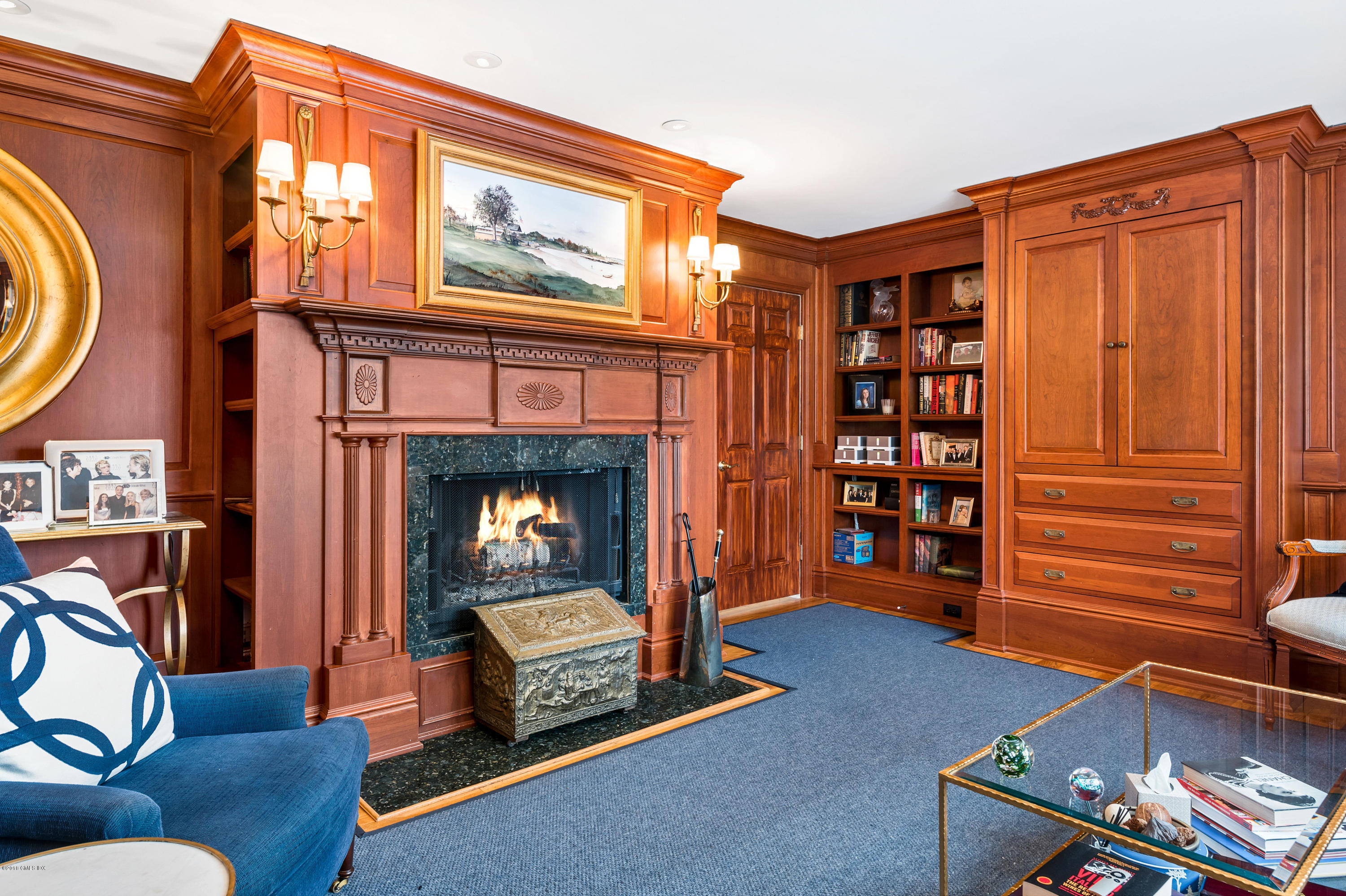 230 Byram Shore Road Greenwich, CT 06830 - Photo 17 of 36 a living room with furniture a fireplace and a window