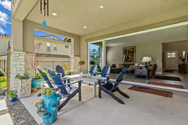 a living room with furniture gym equipment and a fireplace