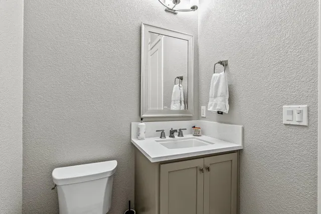 a bathroom with a sink and a toilet