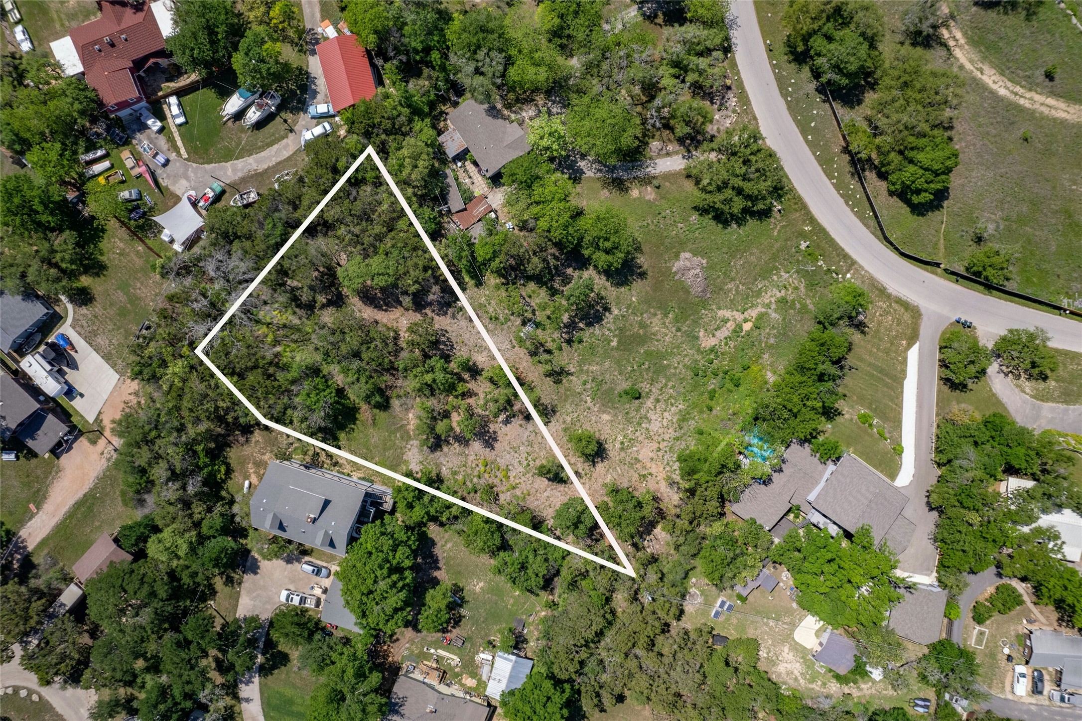 5008 Serrano Trail Austin, TX 78734 - Photo 1 of 21 Aerial view of residential area featuring property parcel outlined