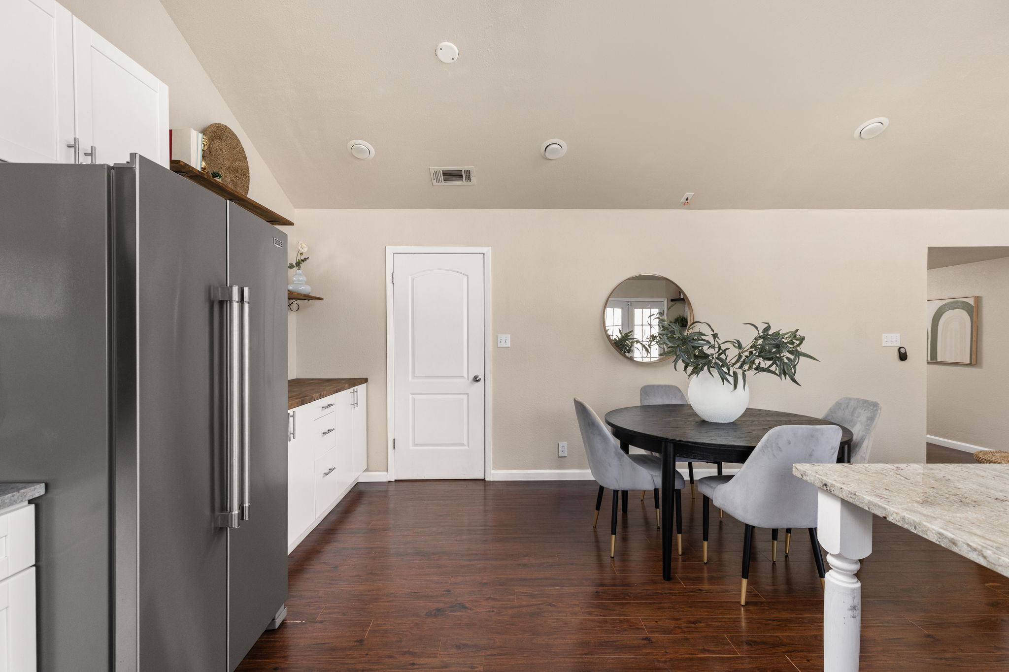 6502 Highpoint Cove Austin, TX 78723 - Photo 17 of 40 Dining space featuring dark wood finished floors and lofted ceiling