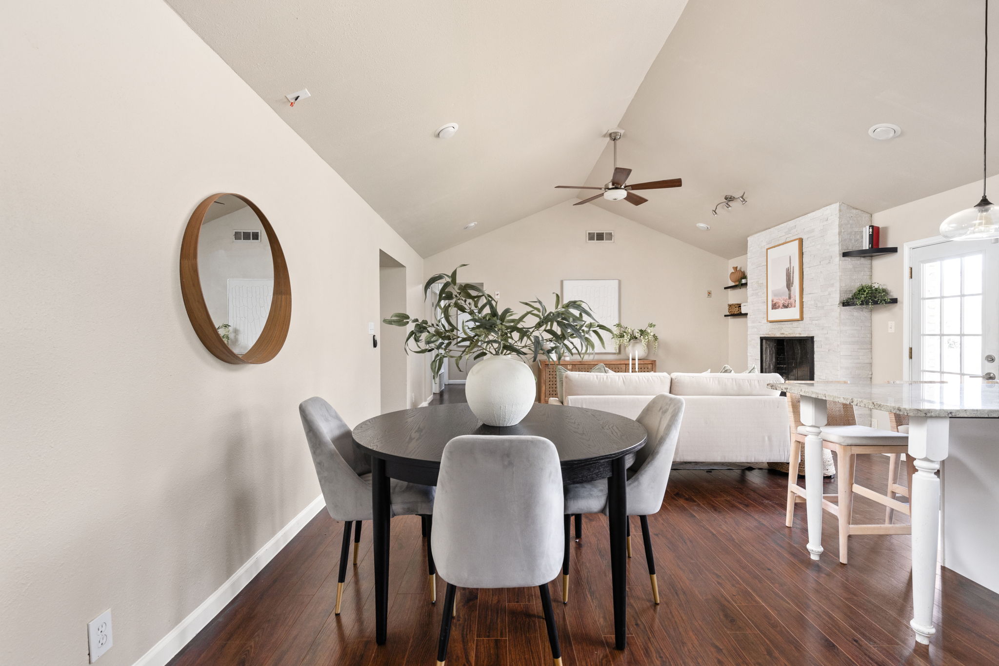 6502 Highpoint Cove Austin, TX 78723 - Photo 20 of 40 Dining area featuring ceiling fan, dark wood-style floors, and a fireplace