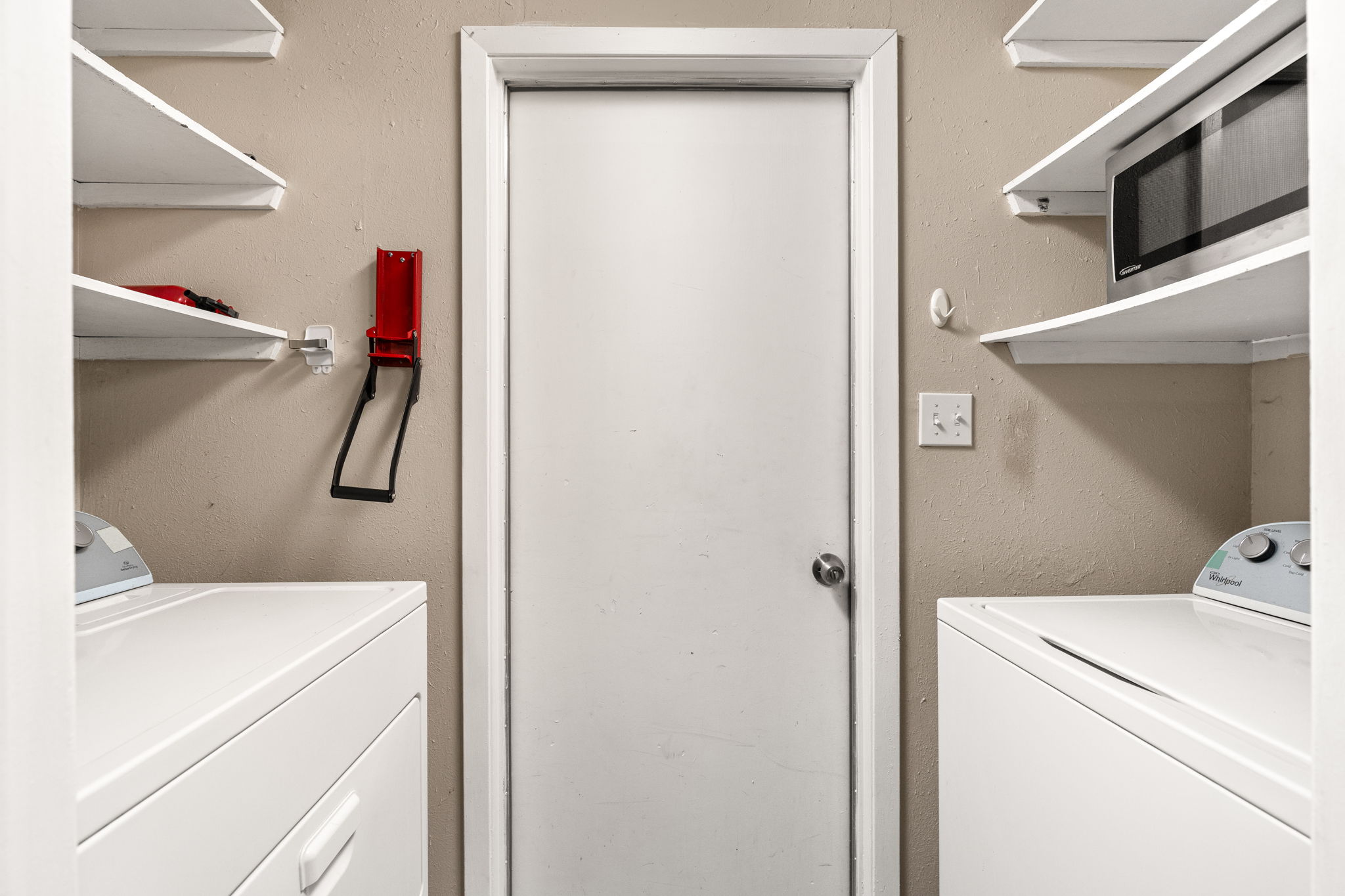 6502 Highpoint Cove Austin, TX 78723 - Photo 21 of 40 Laundry area with independent washer and dryer and a textured wall