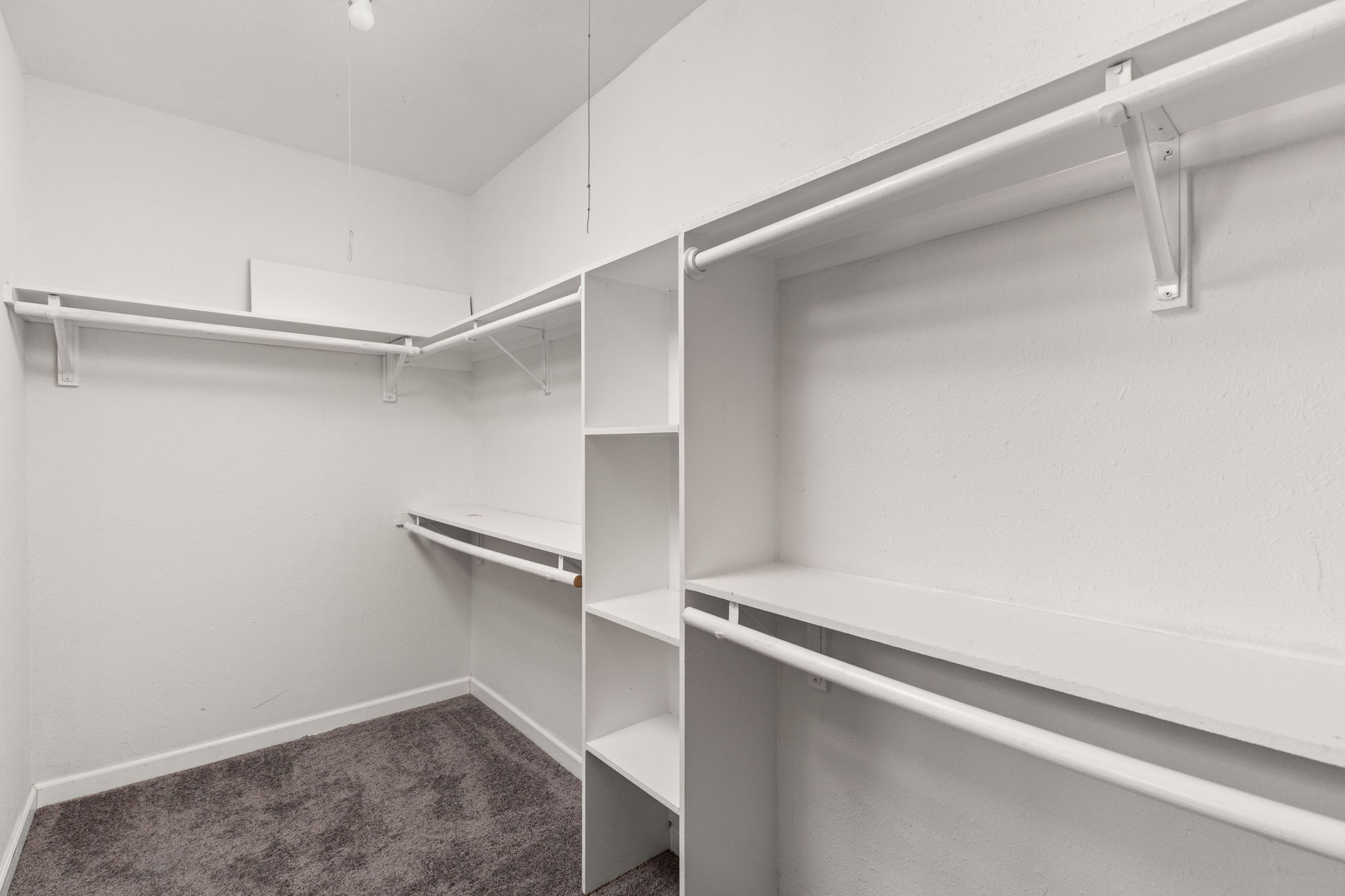 6502 Highpoint Cove Austin, TX 78723 - Photo 25 of 40 Walk in closet featuring dark colored carpet