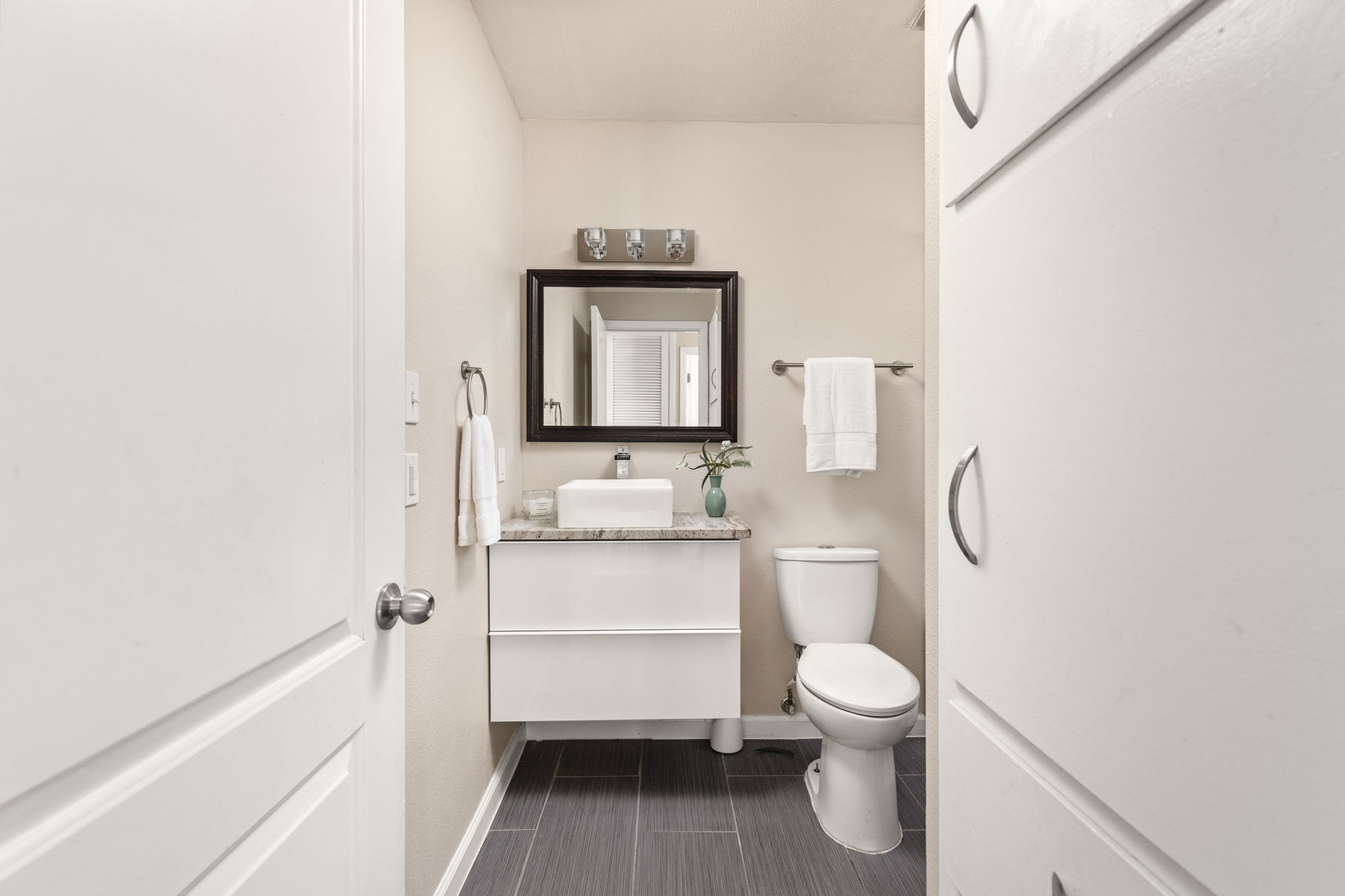 6502 Highpoint Cove Austin, TX 78723 - Photo 27 of 40 Half bath featuring vanity and toilet