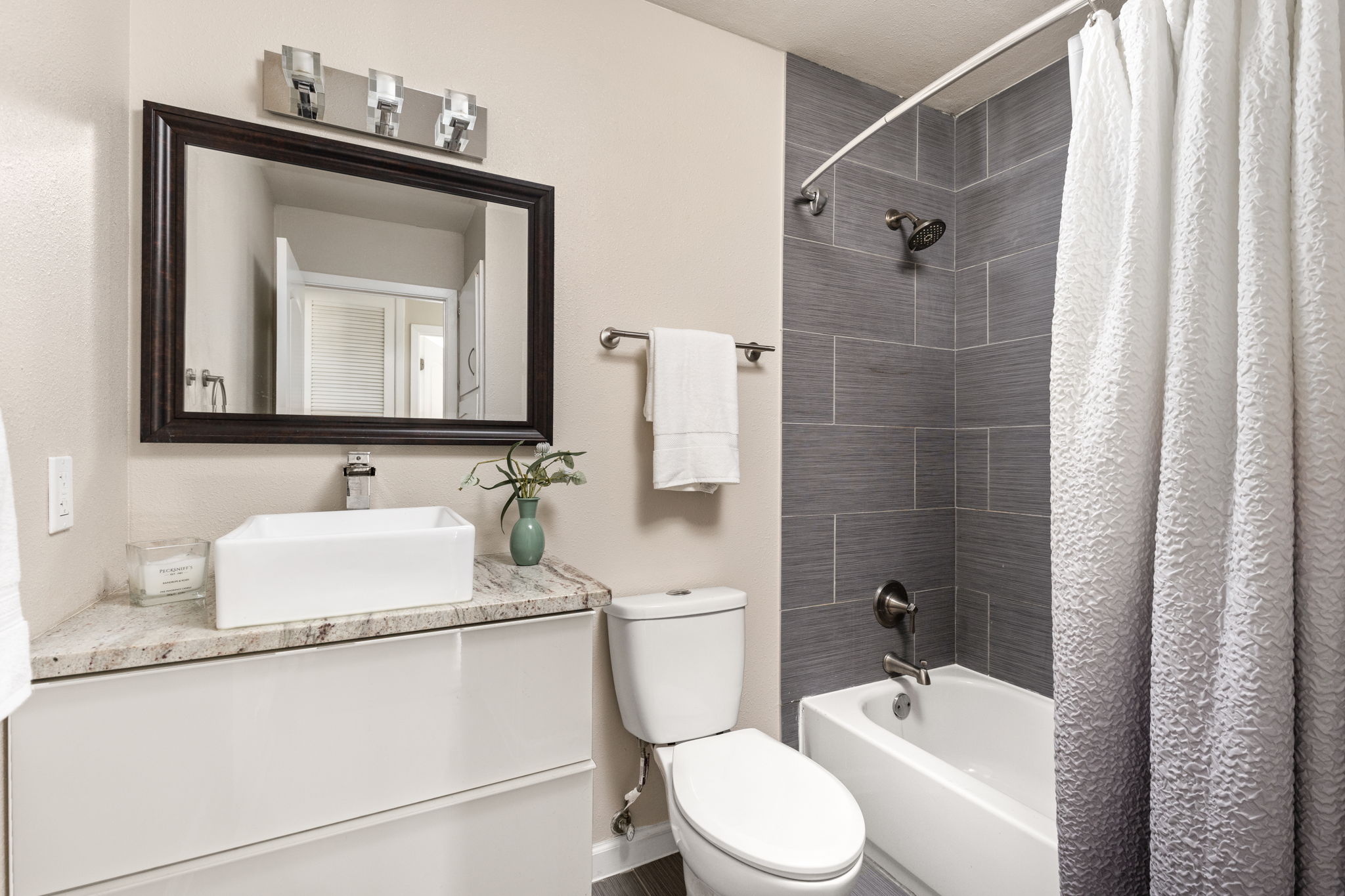 6502 Highpoint Cove Austin, TX 78723 - Photo 28 of 40 Full bathroom featuring vanity and shower / tub combo with curtain