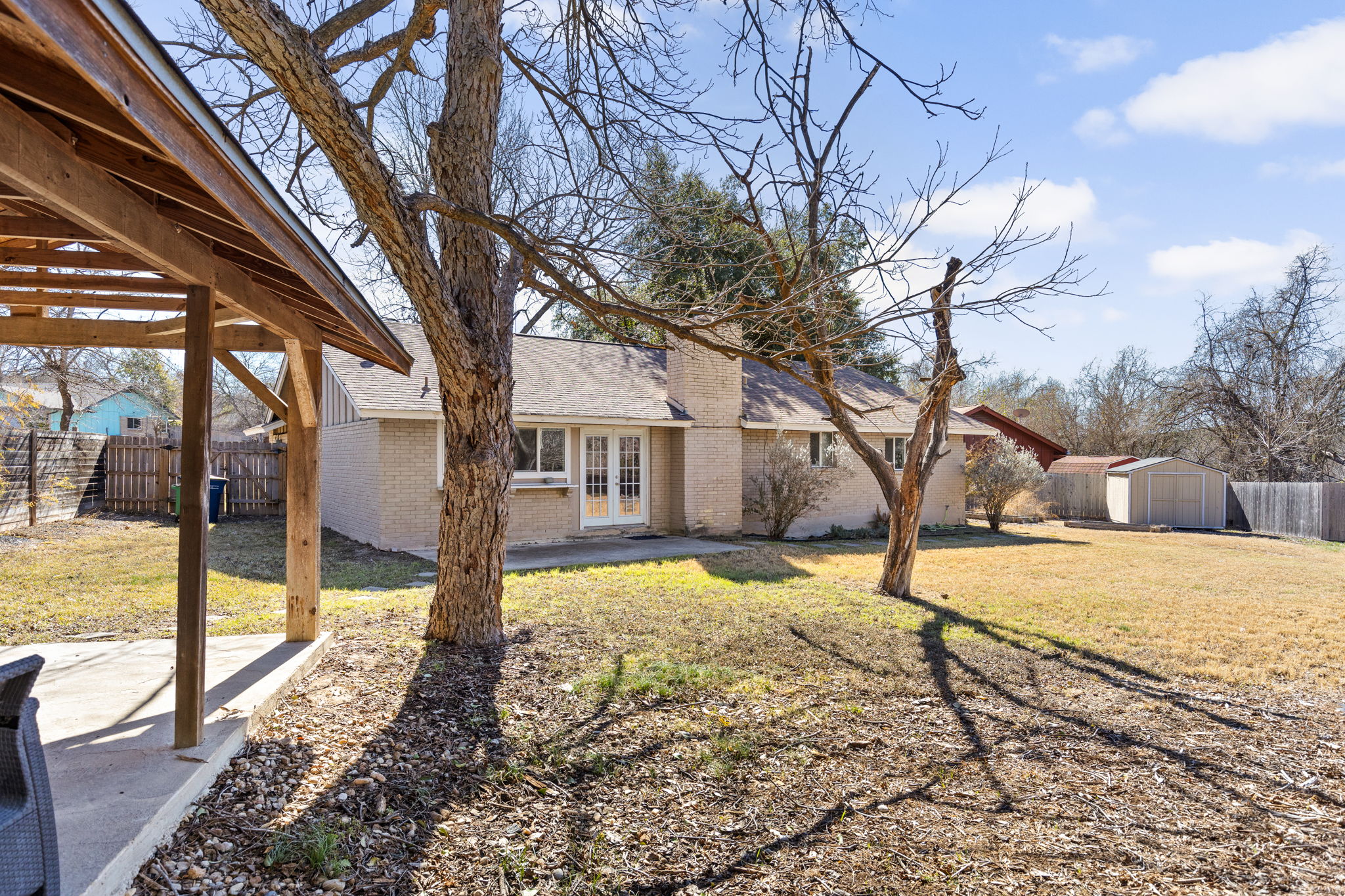 6502 Highpoint Cove Austin, TX 78723 - Photo 34 of 40 Fenced backyard featuring a patio, french doors, and a storage shed
