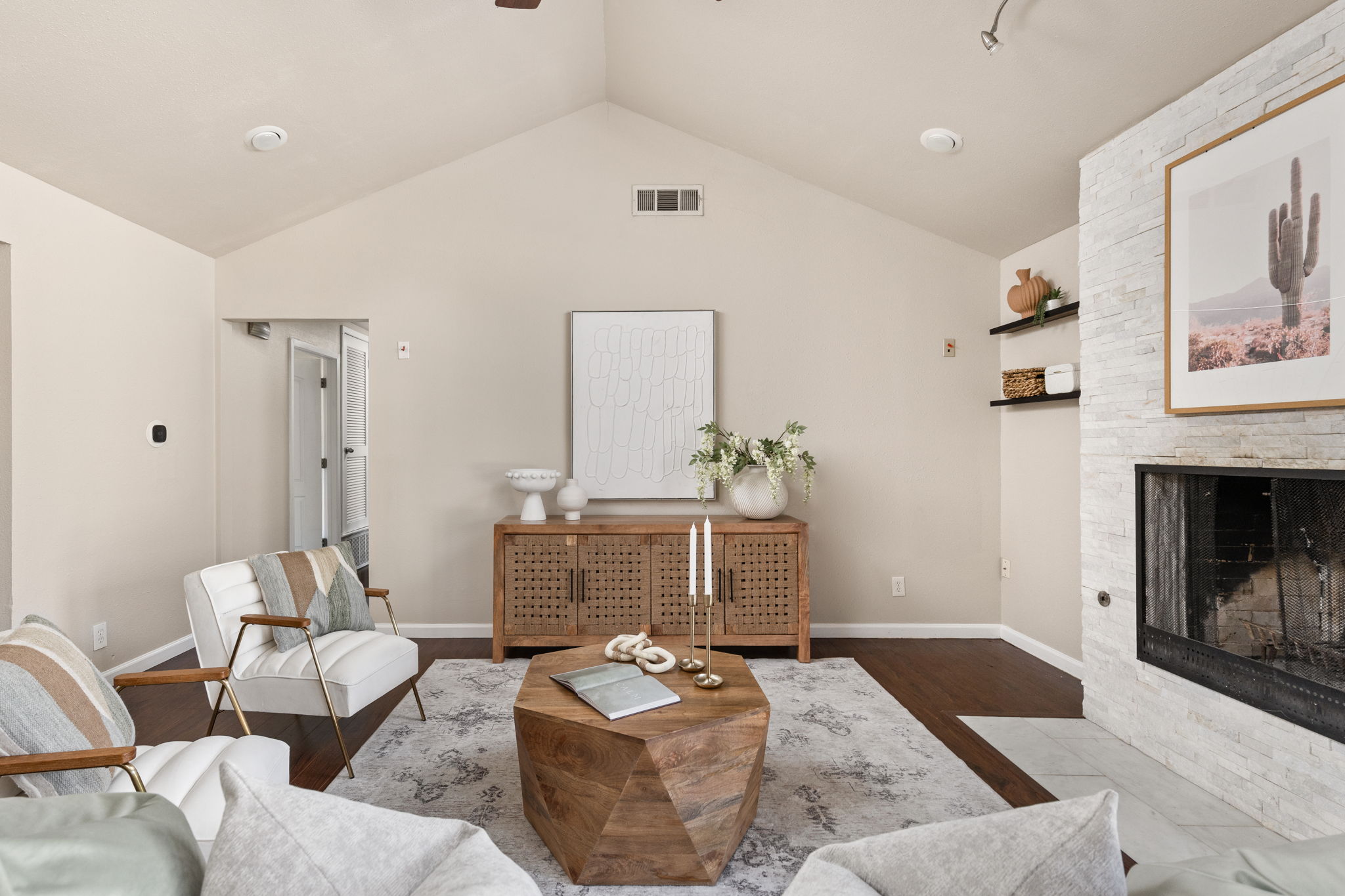 6502 Highpoint Cove Austin, TX 78723 - Photo 8 of 40 Living area with a fireplace, wood finished floors, and a ceiling fan