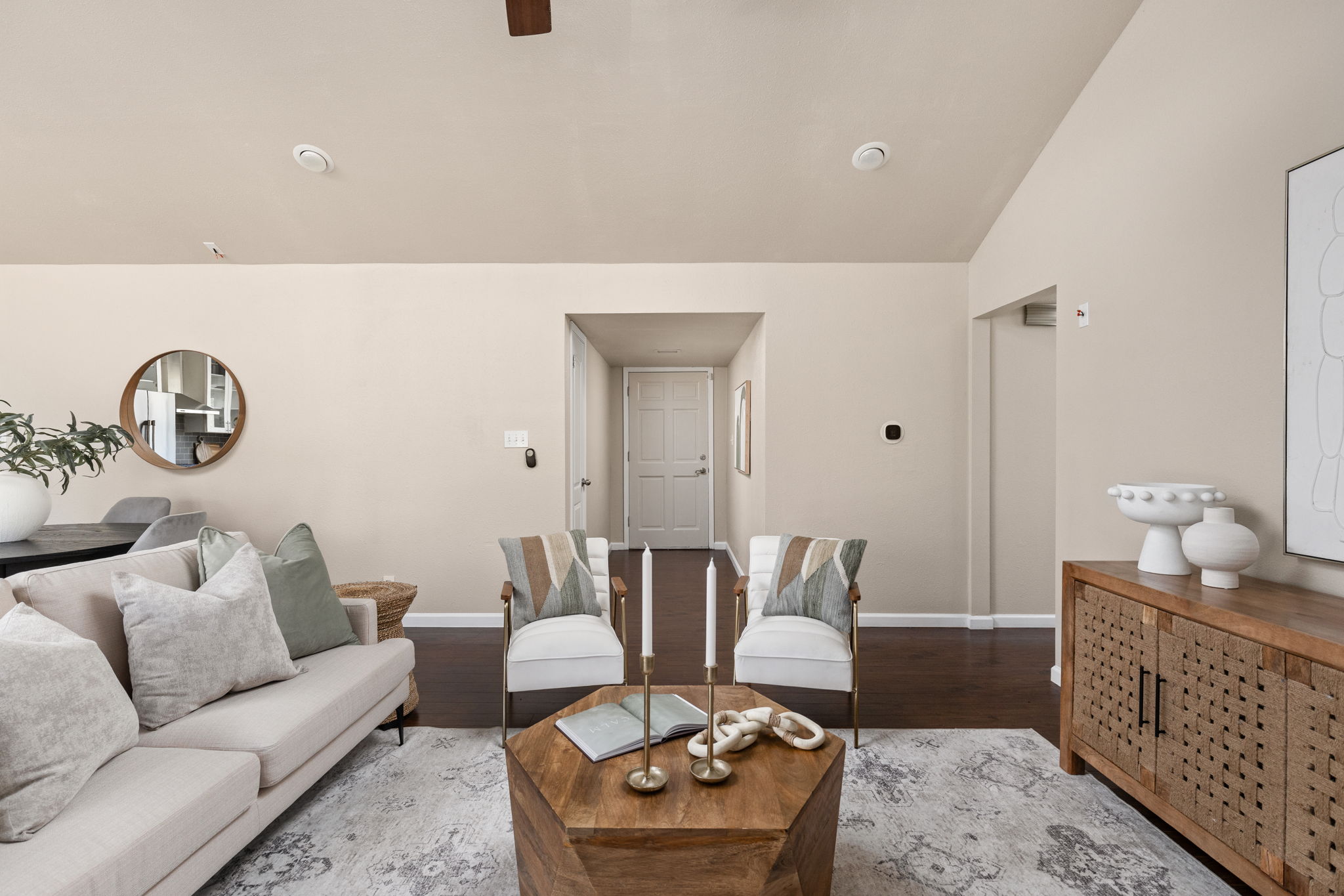 6502 Highpoint Cove Austin, TX 78723 - Photo 10 of 40 Living room with wood finished floors, vaulted ceiling, and ceiling fan