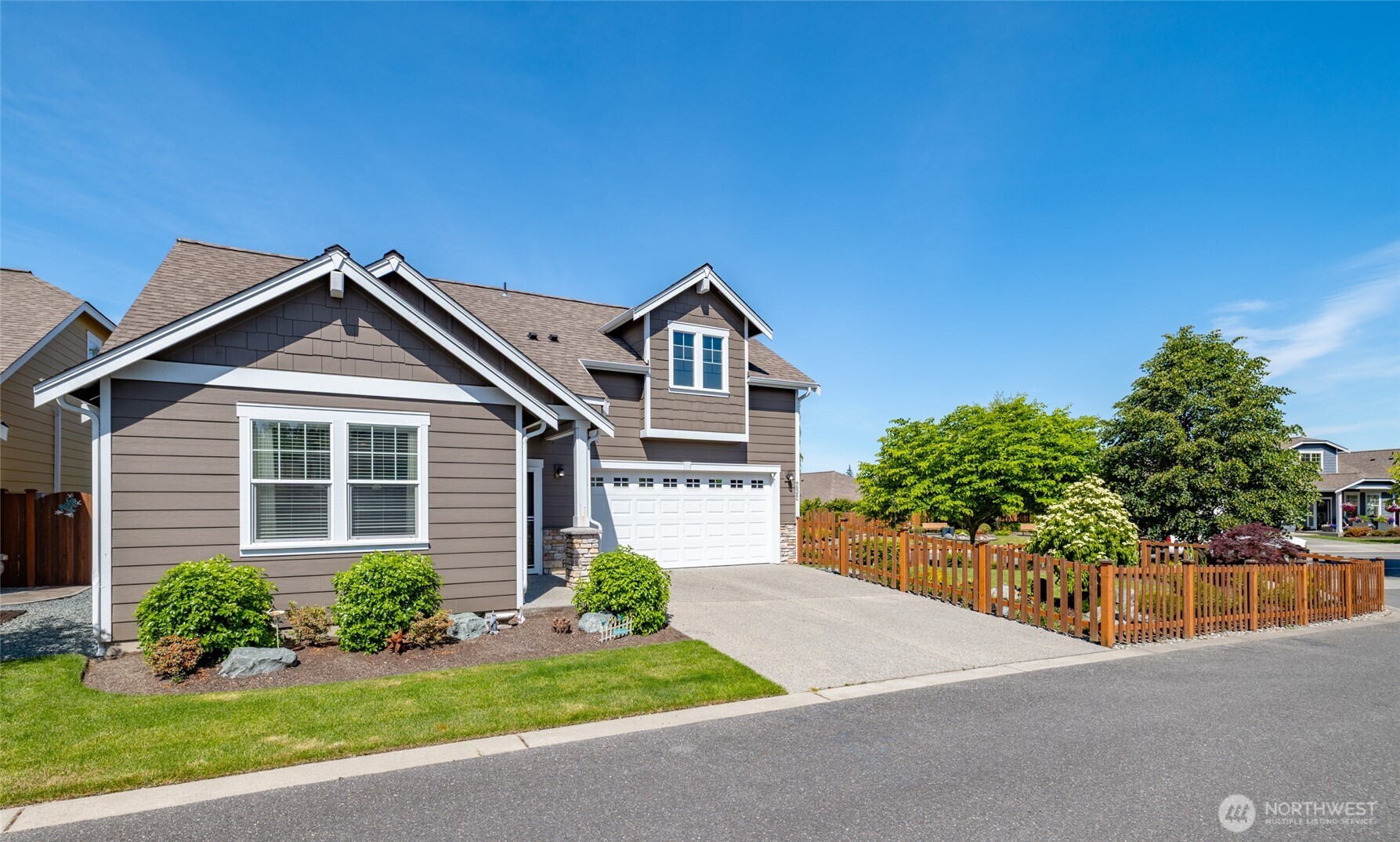 232 Sinclair Alley Mount Vernon, WA 98274 - Photo 27 of 33 a front view of a house with a yard and potted plants