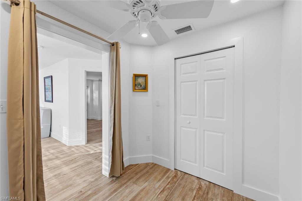 849 Beach Road Sanibel, FL 33957 - Photo 16 of 27 wooden floor in an empty room