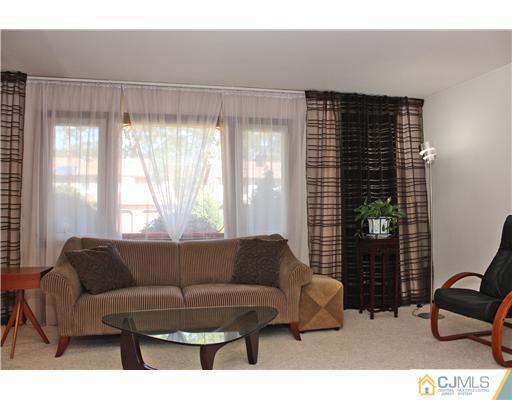 93 South Cliff Road Colonia, NJ 07067 - Photo 17 of 25 a living room with furniture and a window