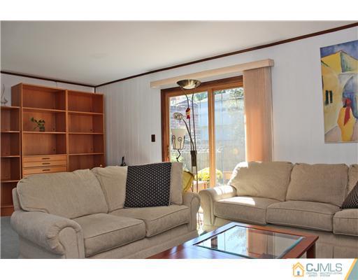 93 South Cliff Road Colonia, NJ 07067 - Photo 19 of 25 a living room with furniture and a large window