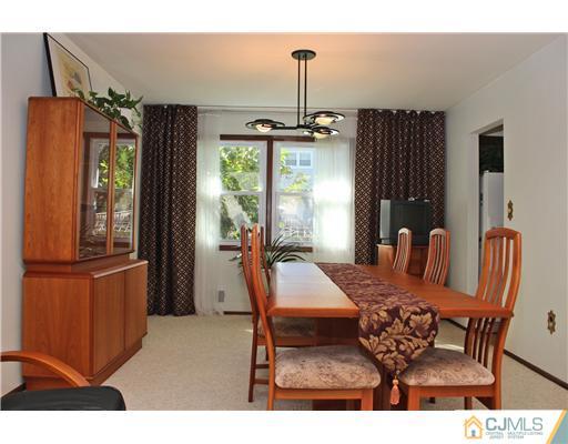 93 South Cliff Road Colonia, NJ 07067 - Photo 4 of 25 a view of a dining room with furniture window and outside view