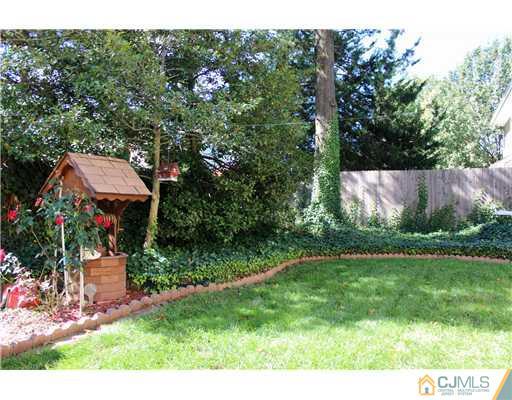 93 South Cliff Road Colonia, NJ 07067 - Photo 8 of 25 a view of backyard with green space