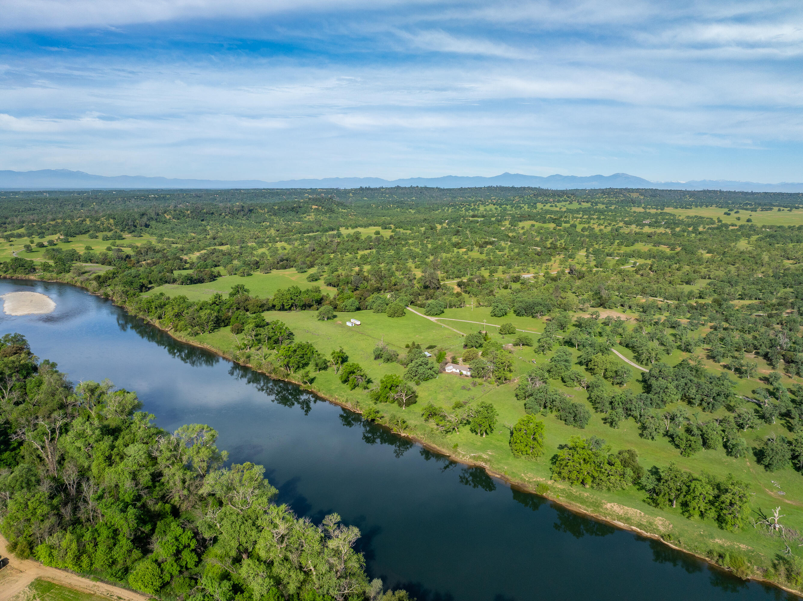 22080 Forbes Way Red Bluff, CA 96080 - Photo 13 of 42 a view of a lake with a yard