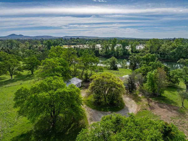 a view of a lake with houses in the back