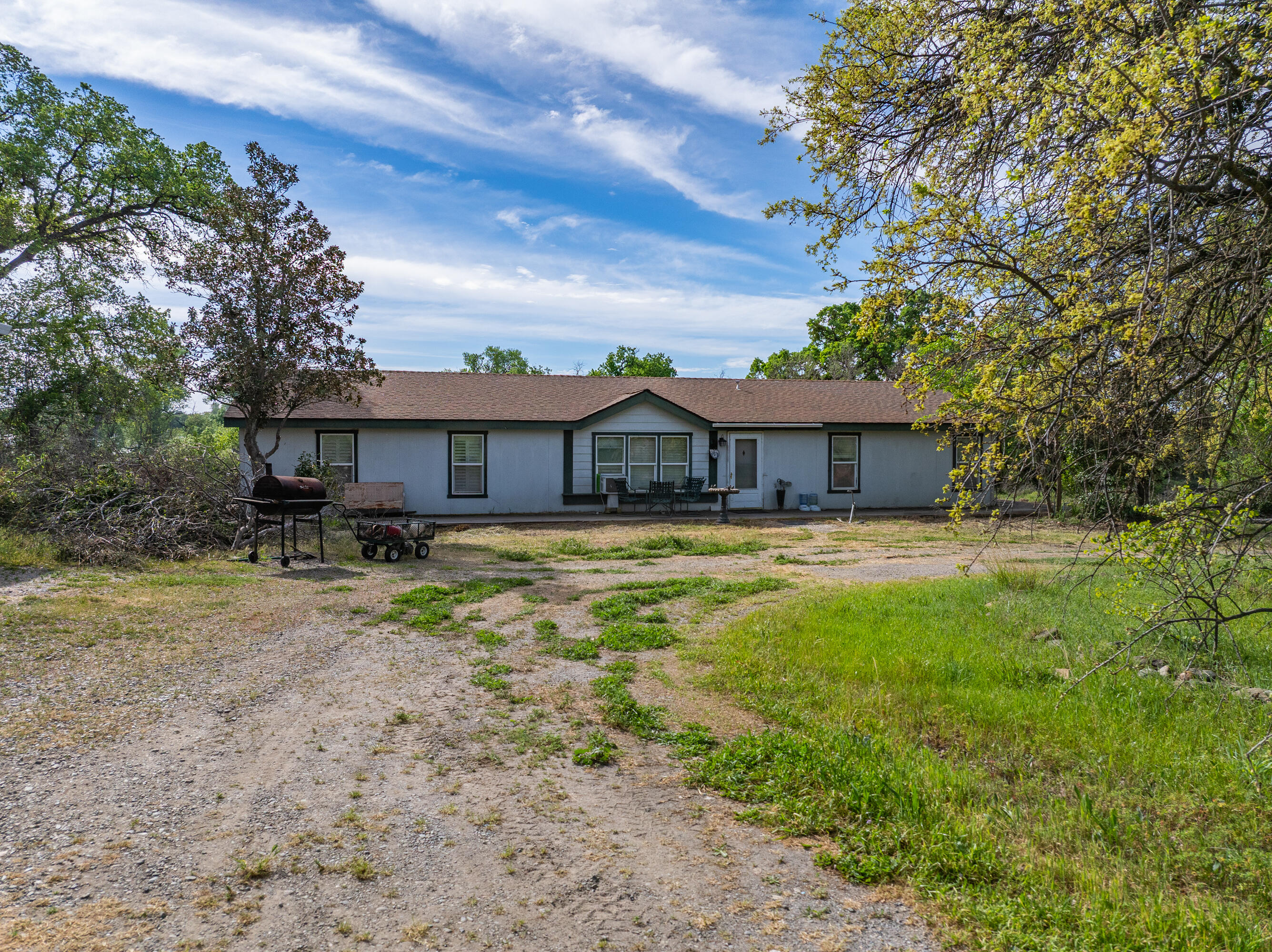 22080 Forbes Way Red Bluff, CA 96080 - Photo 24 of 42 a front view of a house with a yard