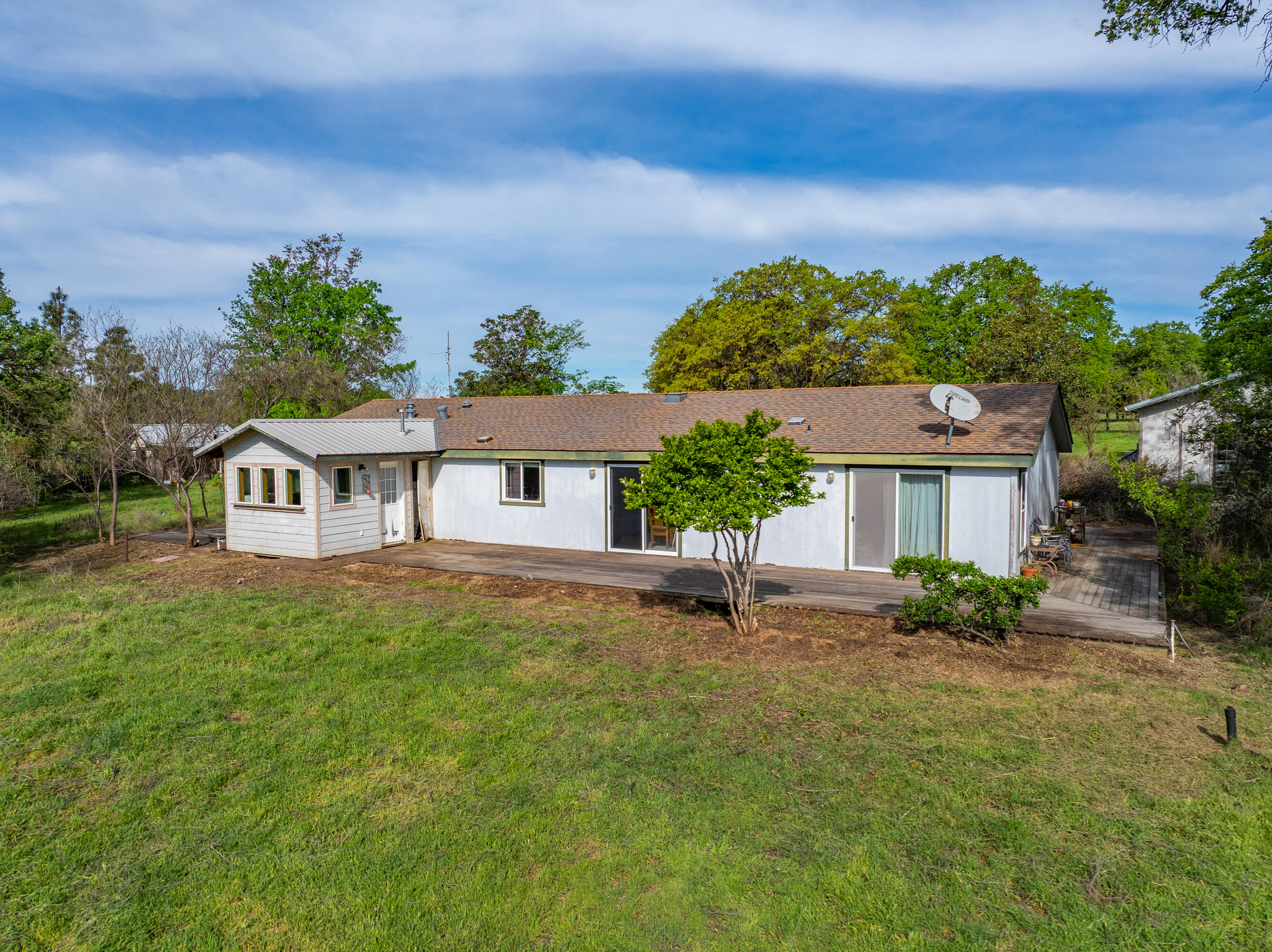 22080 Forbes Way Red Bluff, CA 96080 - Photo 25 of 42 a view of a house with a big yard plants and large trees