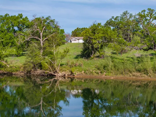 a backyard of a house with a lake view