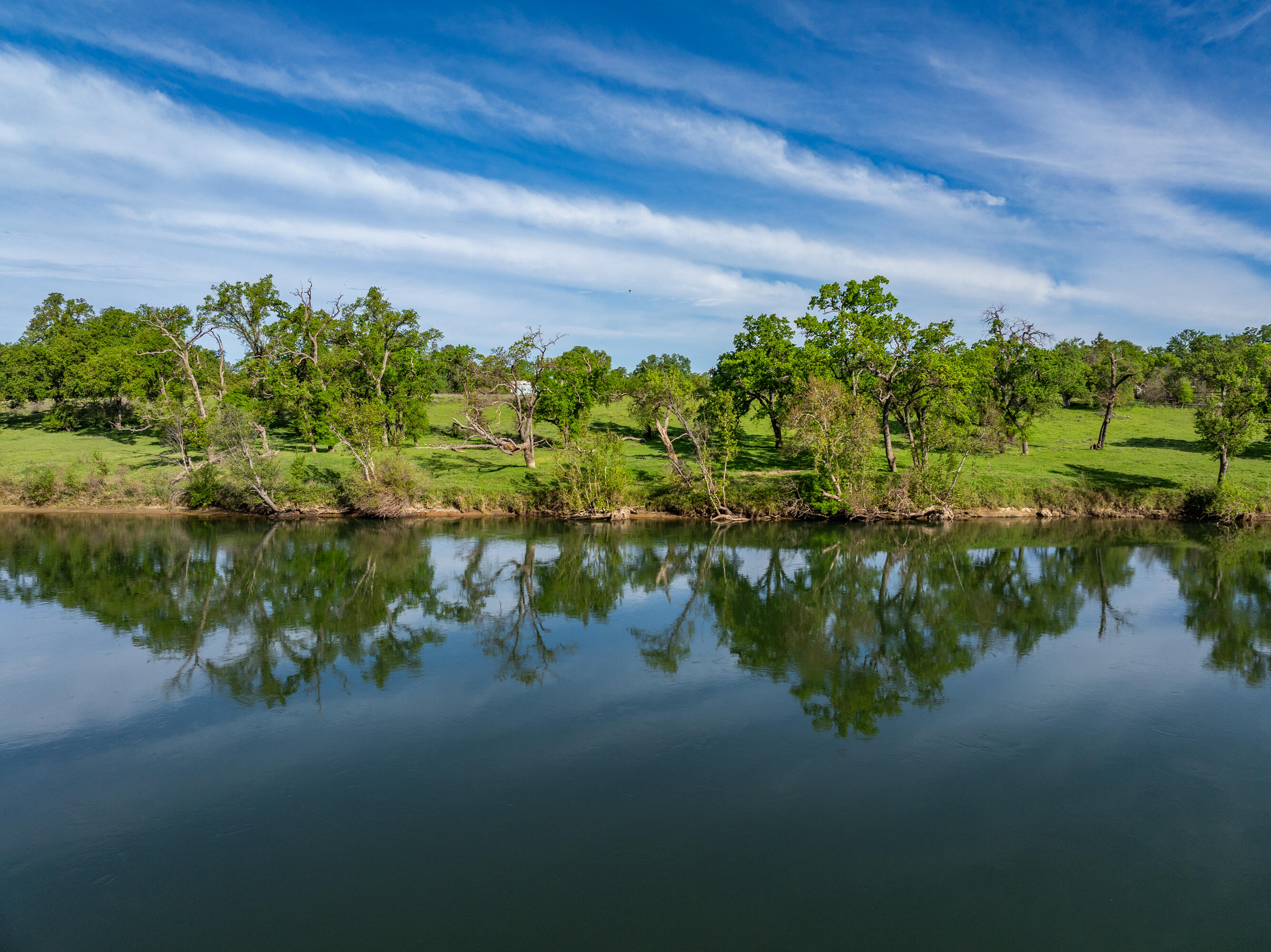 22080 Forbes Way Red Bluff, CA 96080 - Photo 5 of 42 a backyard of a house with a lake view
