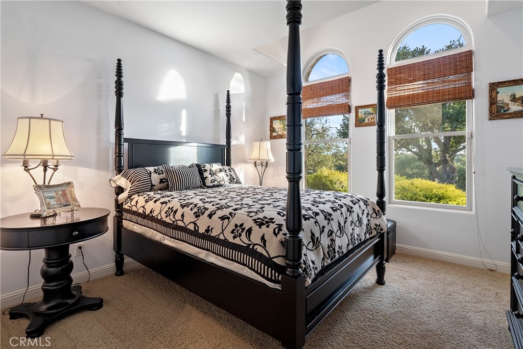 2438 Battering Rock Road Templeton, CA 93465 - Photo 15 of 60 a bedroom with a bed a dresser next to a window