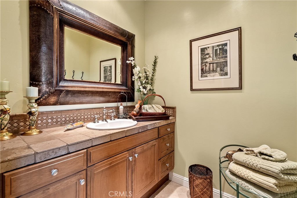 2438 Battering Rock Road Templeton, CA 93465 - Photo 23 of 60 a bathroom with a sink and a mirror