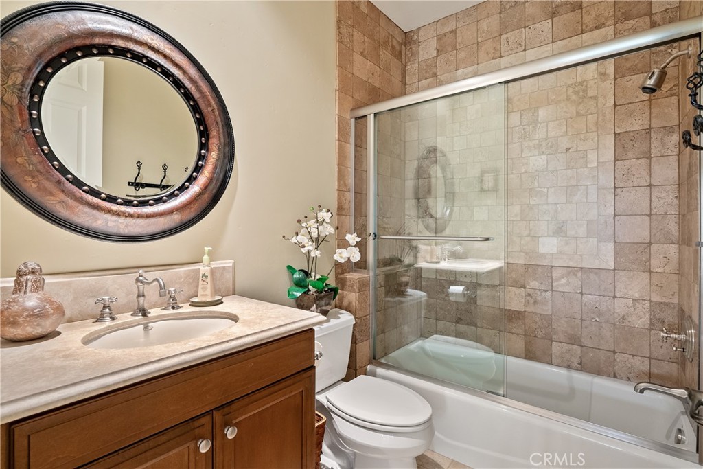 2438 Battering Rock Road Templeton, CA 93465 - Photo 37 of 60 a bathroom with a sink a toilet and a mirror