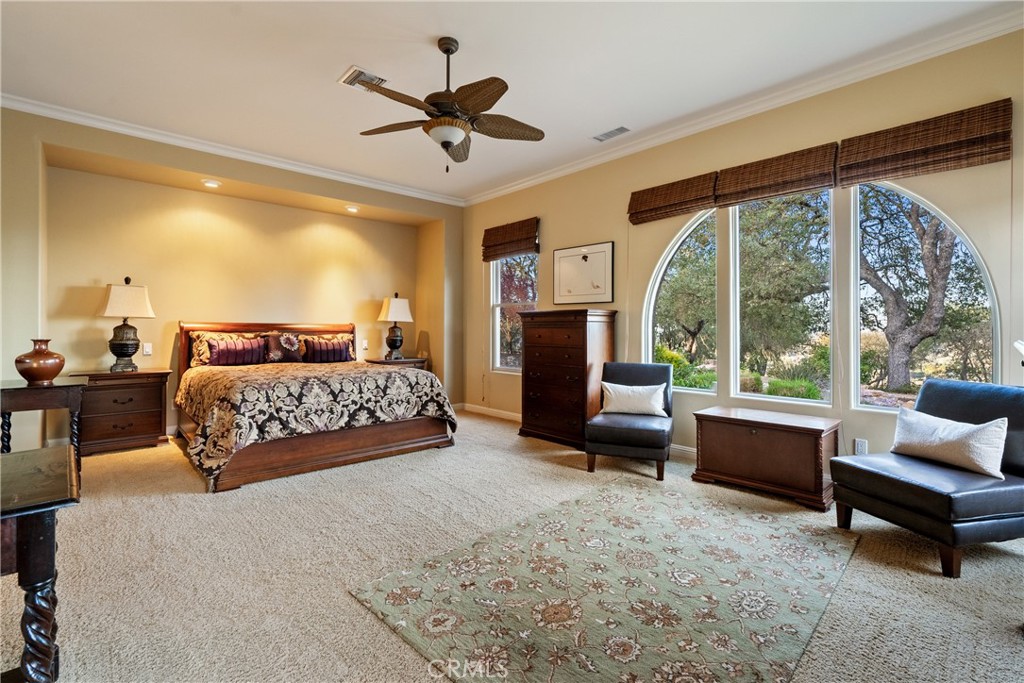 2438 Battering Rock Road Templeton, CA 93465 - Photo 9 of 60 a bedroom with a large bed and a couch