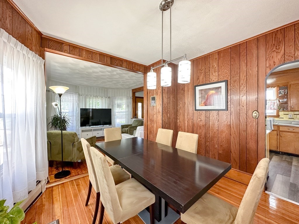 82 Jefferson Avenue Everett, MA 02149 - Photo 11 of 37 a view of a dining room with furniture window and wooden floor