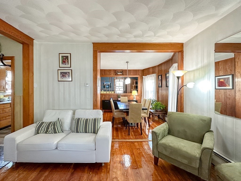 82 Jefferson Avenue Everett, MA 02149 - Photo 14 of 37 a living room with furniture and a large window