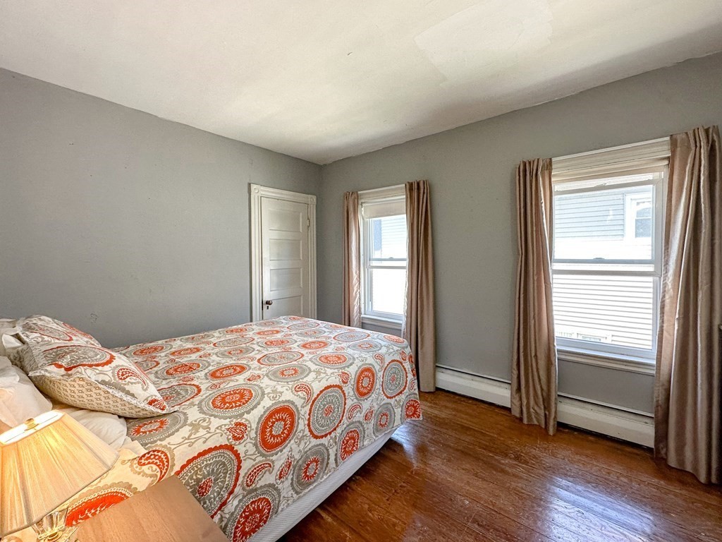 82 Jefferson Avenue Everett, MA 02149 - Photo 19 of 37 a bedroom with a bed and a window