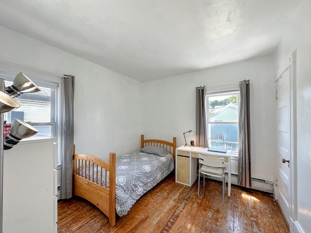82 Jefferson Avenue Everett, MA 02149 - Photo 25 of 37 a bedroom with a bed and a window