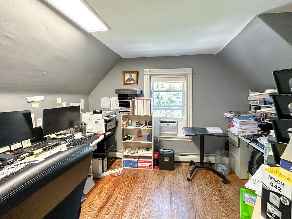 82 Jefferson Avenue Everett, MA 02149 - Photo 27 of 37 a view of a workspace with furniture and a window