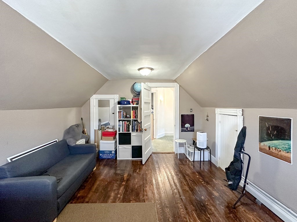 82 Jefferson Avenue Everett, MA 02149 - Photo 29 of 37 a living room with furniture and wooden floor
