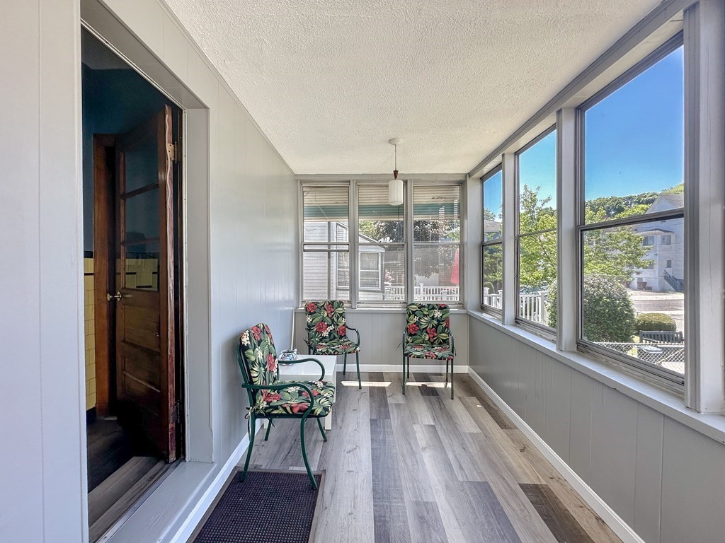 82 Jefferson Avenue Everett, MA 02149 - Photo 31 of 37 a living room with furniture and a large window
