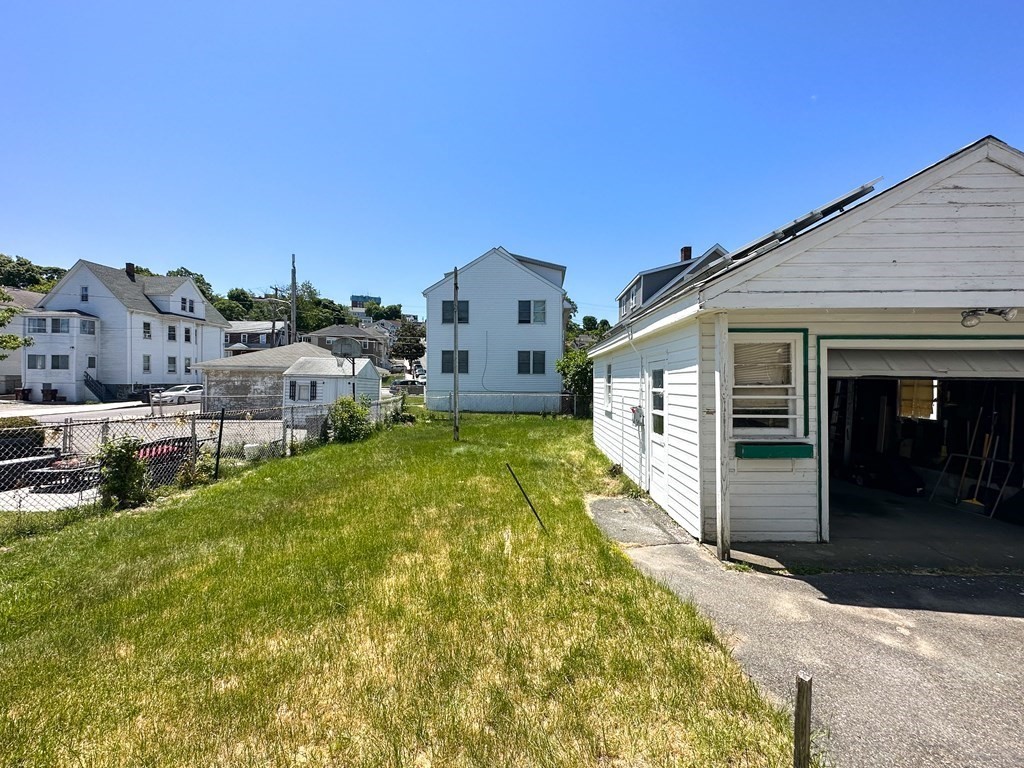 82 Jefferson Avenue Everett, MA 02149 - Photo 35 of 37 a front view of a house with a yard
