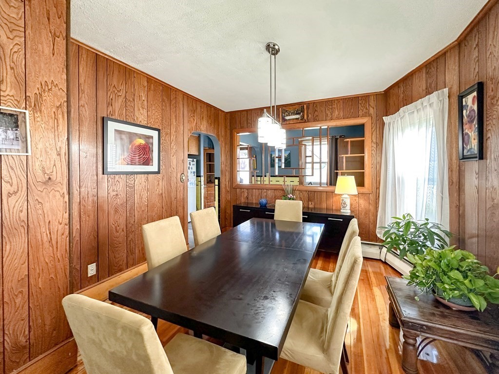82 Jefferson Avenue Everett, MA 02149 - Photo 8 of 37 a view of a dining room with furniture window and wooden floor