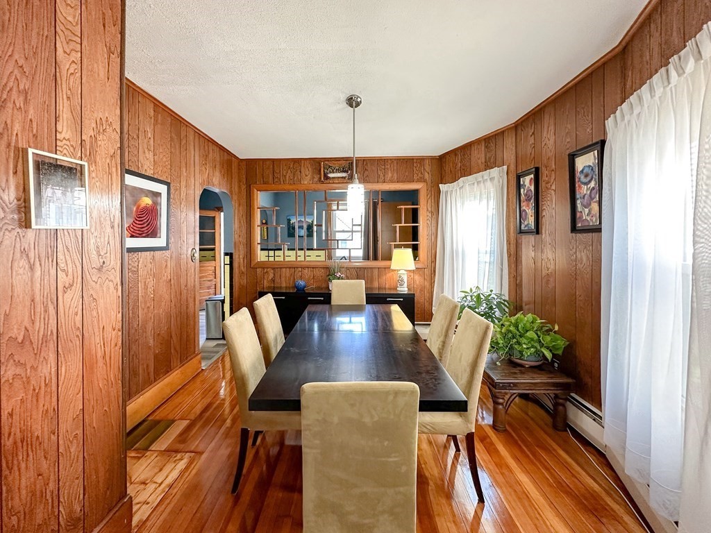 82 Jefferson Avenue Everett, MA 02149 - Photo 10 of 37 a view of a dining room with furniture window and wooden floor