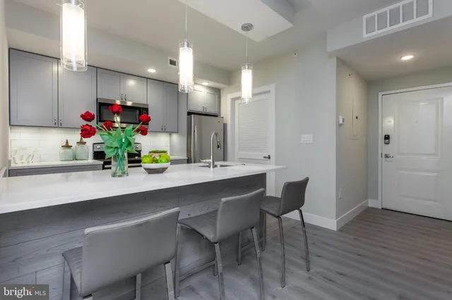 a view of a dining room with furniture and wooden floor