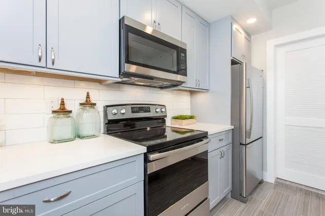a kitchen with a stove and a microwave