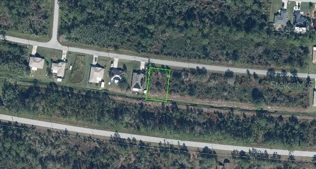 a view of a small yard from a balcony