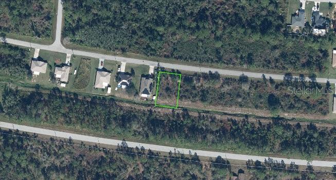 a view of a small yard from a balcony