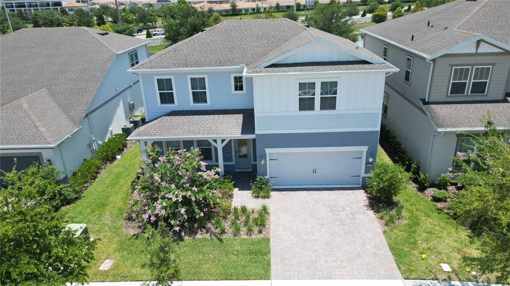10746 Pahokee Beach Place Orlando, FL 32827 - Photo 4 of 67 front view of house with a yard