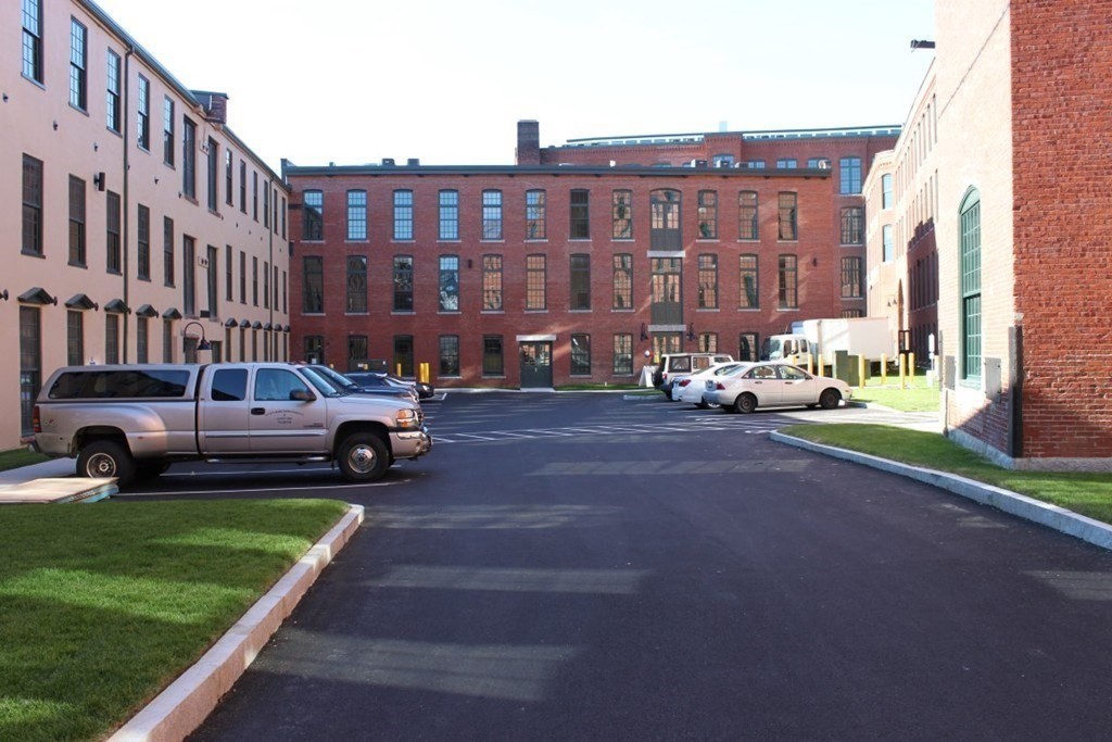 64 Beacon Street, Unit C105 Worcester, MA 01608 - Photo 12 of 23 a view of a cars parked in front of a building