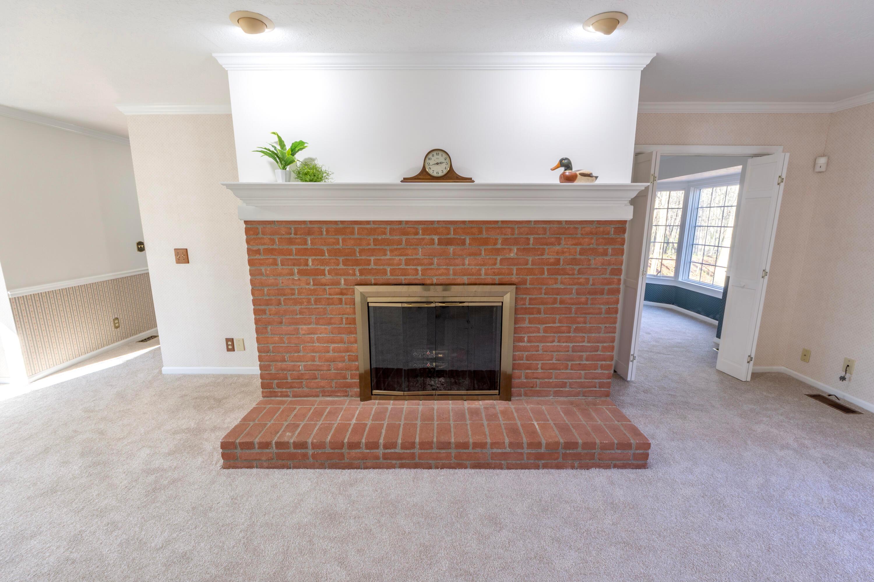 3880 Fry Road Ostrander, OH 43061 - Photo 27 of 82 Beautiful raised-hearth wood burning fireplace with mantle!