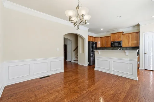 a view of a kitchen with microwave and cabinets